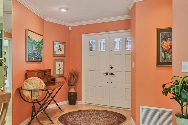 foyer entrance featuring crown molding