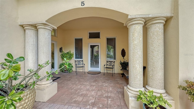 property entrance featuring a patio area