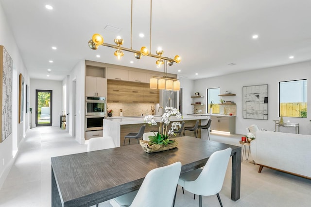 dining area featuring an inviting chandelier