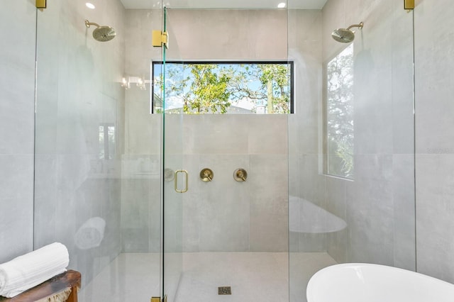 bathroom with shower with separate bathtub