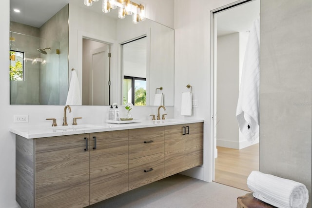 bathroom featuring vanity, tile patterned floors, and walk in shower