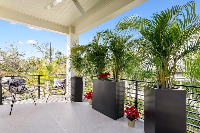 view of patio / terrace featuring ceiling fan and a balcony