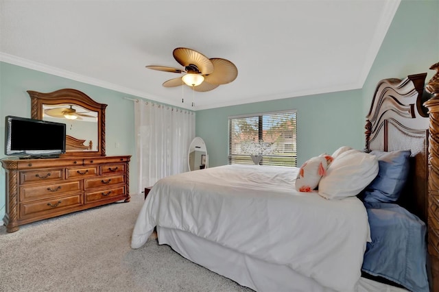 bedroom featuring ceiling fan, light carpet, and crown molding