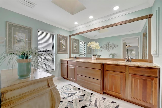 bathroom with vanity, ornamental molding, and tile patterned flooring