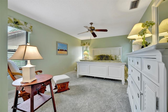 bedroom with light colored carpet and ceiling fan