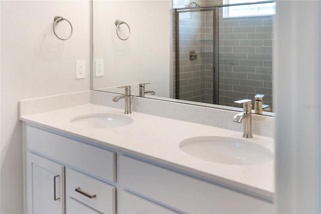 bathroom with vanity and an enclosed shower