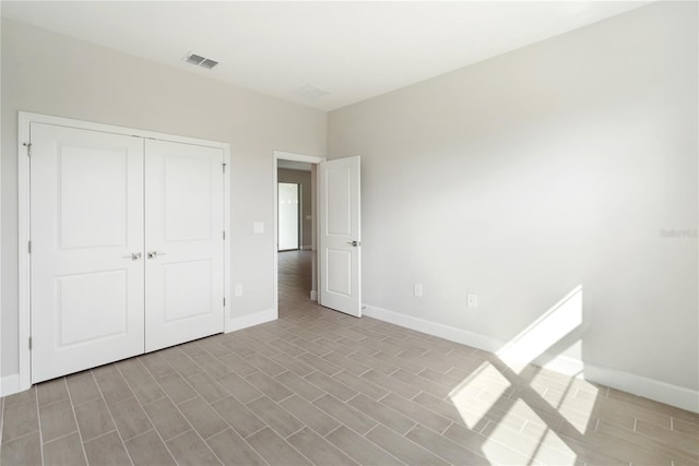 unfurnished bedroom featuring a closet