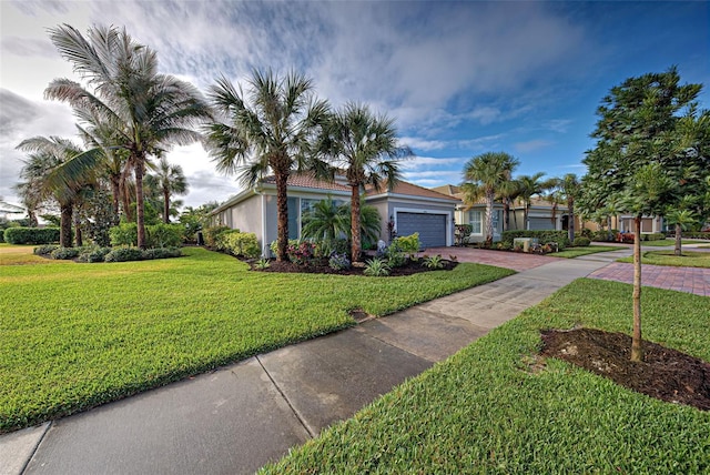 view of front of property featuring a garage and a front yard