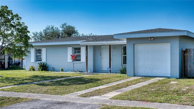 ranch-style house with a garage and a front yard