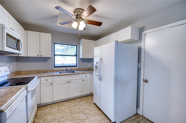 kitchen with ceiling fan, white appliances, sink, and white cabinets