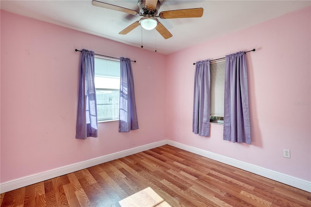 unfurnished room with ceiling fan and light hardwood / wood-style floors