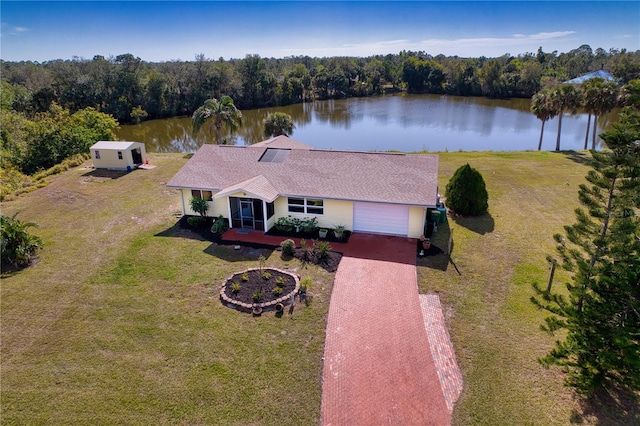 birds eye view of property featuring a water view