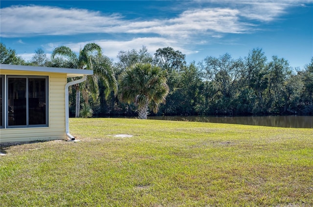 view of yard with a water view