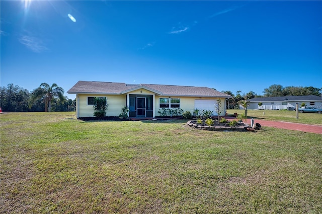 single story home with a garage and a front yard