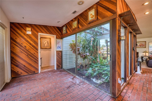 interior space featuring wooden walls