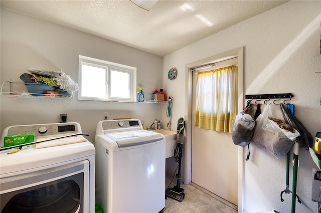 laundry room with light tile patterned floors, a textured ceiling, and independent washer and dryer