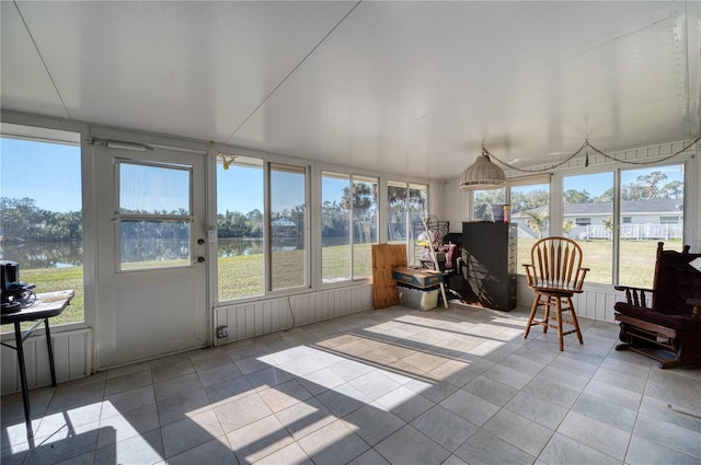 sunroom with a water view