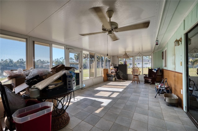 sunroom / solarium with ceiling fan