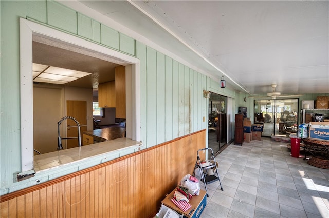 interior space featuring tile counters and light tile patterned flooring