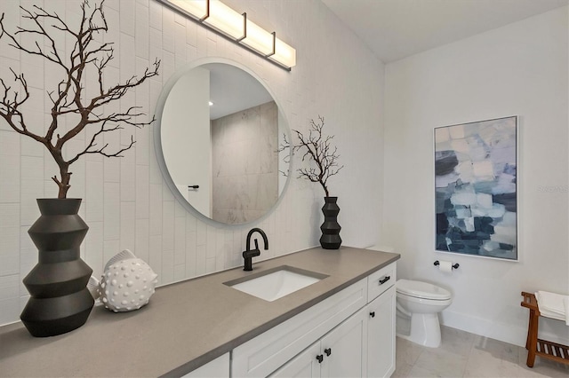 bathroom with toilet and vanity