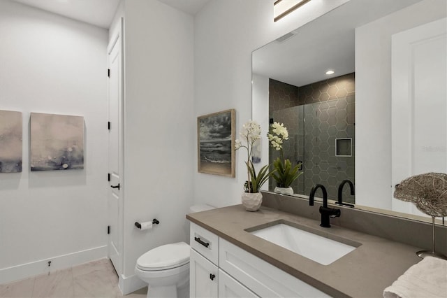 bathroom with toilet, tile patterned floors, vanity, and tiled shower