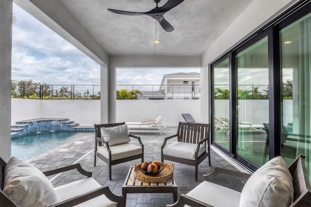 view of patio / terrace featuring an outdoor hangout area, ceiling fan, and a fenced in pool