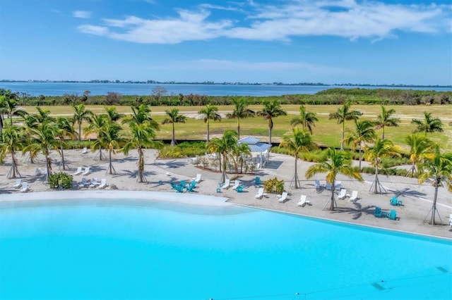 view of pool with a water view