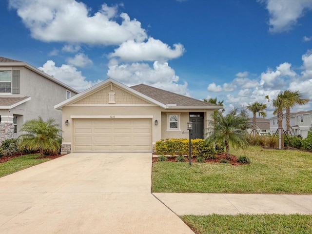 view of front of home with a garage and a front yard