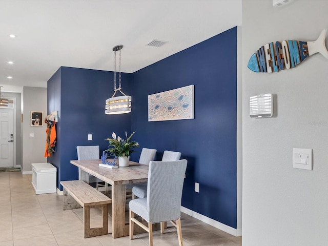 dining space featuring light tile patterned floors