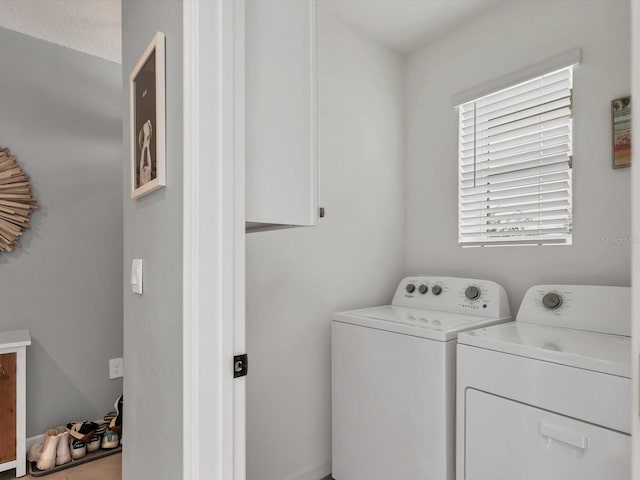 laundry room with washing machine and dryer