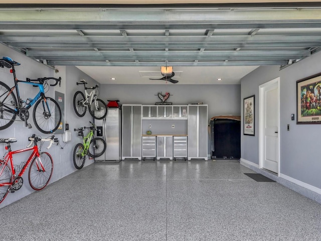 garage featuring stainless steel refrigerator with ice dispenser and a garage door opener