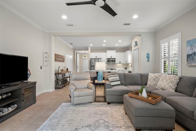 tiled living room featuring ceiling fan and crown molding