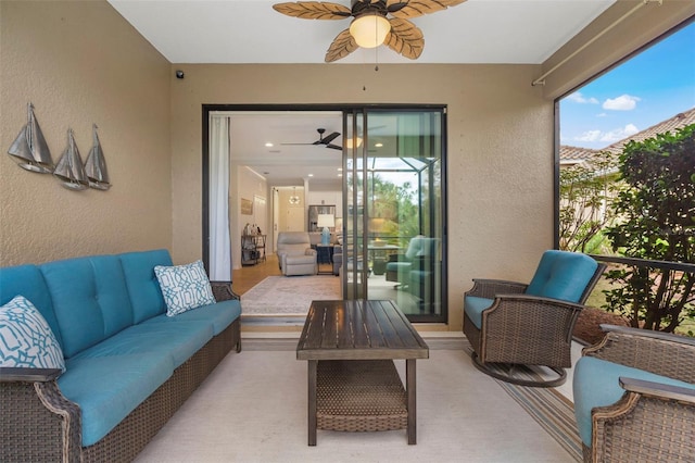 sunroom featuring ceiling fan