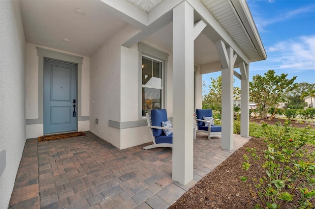 entrance to property with a patio area