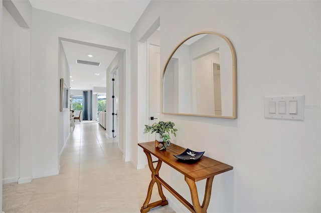 hallway with light tile patterned flooring