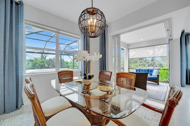 dining room featuring a notable chandelier and light tile patterned flooring