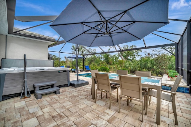 view of patio / terrace featuring a swimming pool with hot tub and a lanai