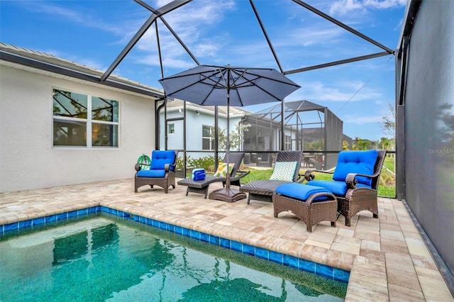 view of swimming pool featuring a patio, an outdoor hangout area, and glass enclosure