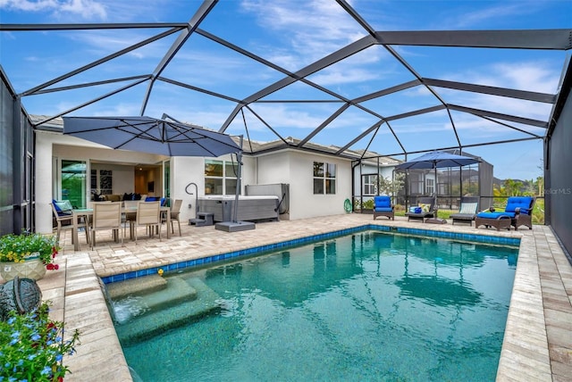 view of swimming pool featuring glass enclosure, an outdoor hangout area, a patio area, and a hot tub