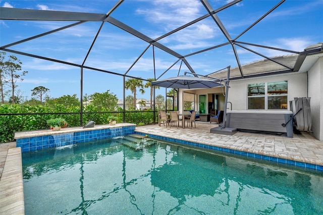 view of swimming pool with pool water feature, a lanai, a jacuzzi, and a patio area