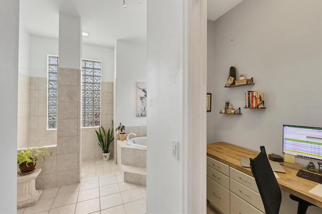 interior space featuring independent shower and bath and tile patterned flooring