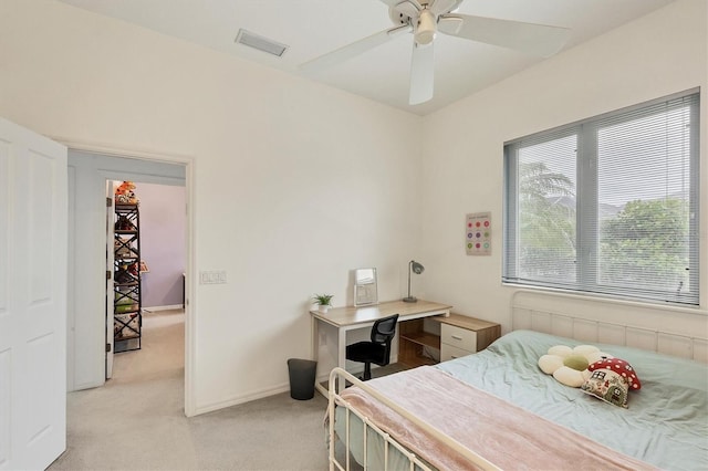 bedroom with ceiling fan and light carpet