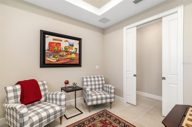 living area featuring light tile patterned floors