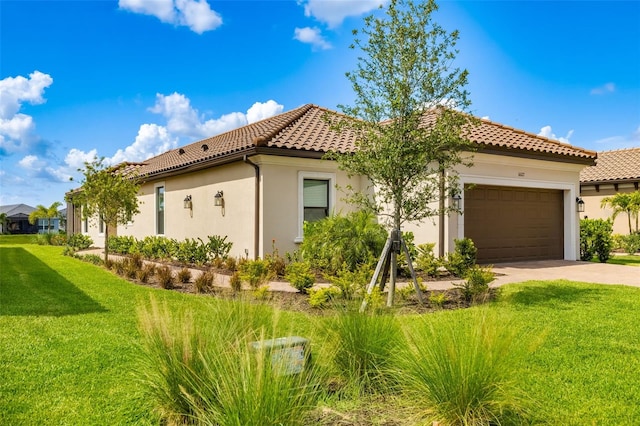 16127 Fortezza Dr, Bradenton, FL 34211 - mediterranean / spanish home with a tiled roof, concrete driveway, stucco siding, a front lawn, and a garage