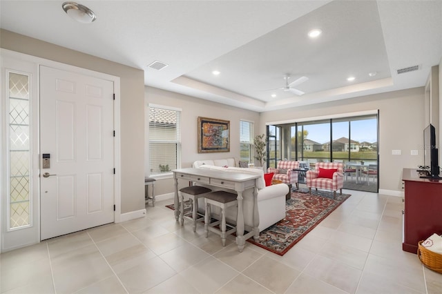 16127 Fortezza Dr, Bradenton, FL 34211 - living area featuring a tray ceiling, ceiling fan, and recessed lighting