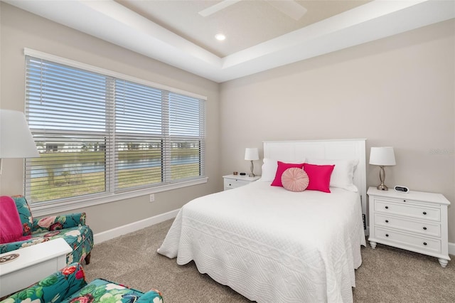 16127 Fortezza Dr, Bradenton, FL 34211 - carpeted bedroom with a water view, recessed lighting, a tray ceiling, and ceiling fan