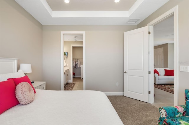 16127 Fortezza Dr, Bradenton, FL 34211 - bedroom with a raised ceiling, recessed lighting, and light carpet