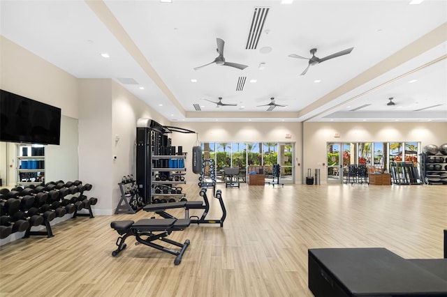 16127 Fortezza Dr, Bradenton, FL 34211 - workout area featuring a raised ceiling, wood finished floors, ceiling fan, and recessed lighting
