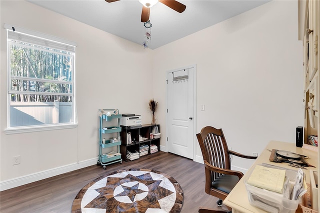 office area featuring baseboards, ceiling fan, and wood finished floors