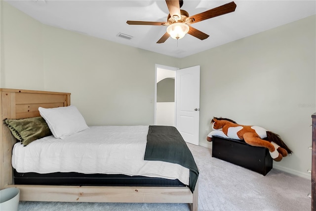 bedroom featuring visible vents, carpet flooring, and a ceiling fan